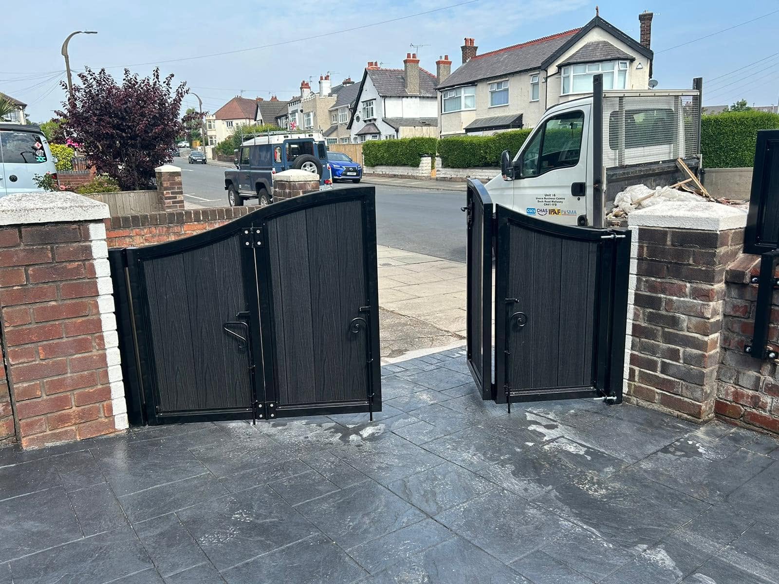 Pair of black driveway gates viewed from inside the property