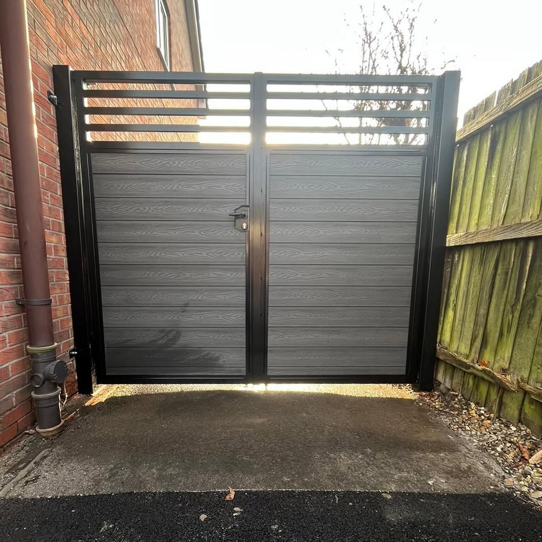 Modern horizontal slatted metal pedestrian gate