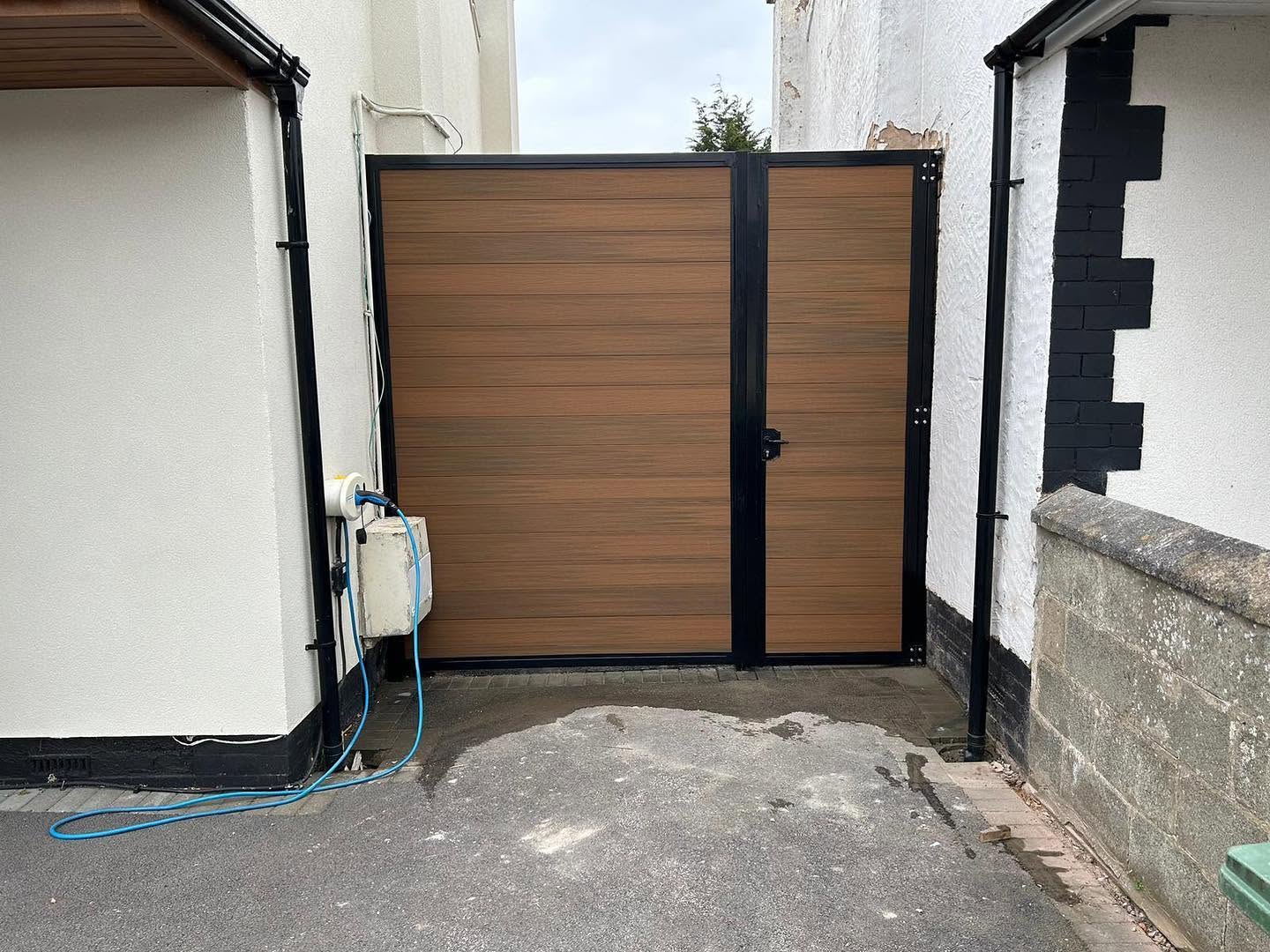 Brown composite side gate in a black frame